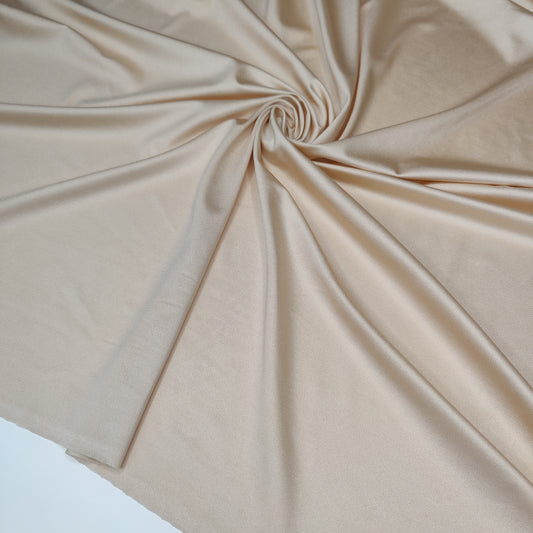 Microfiber, bi-elastic laundry fabric in beige with shimmer
